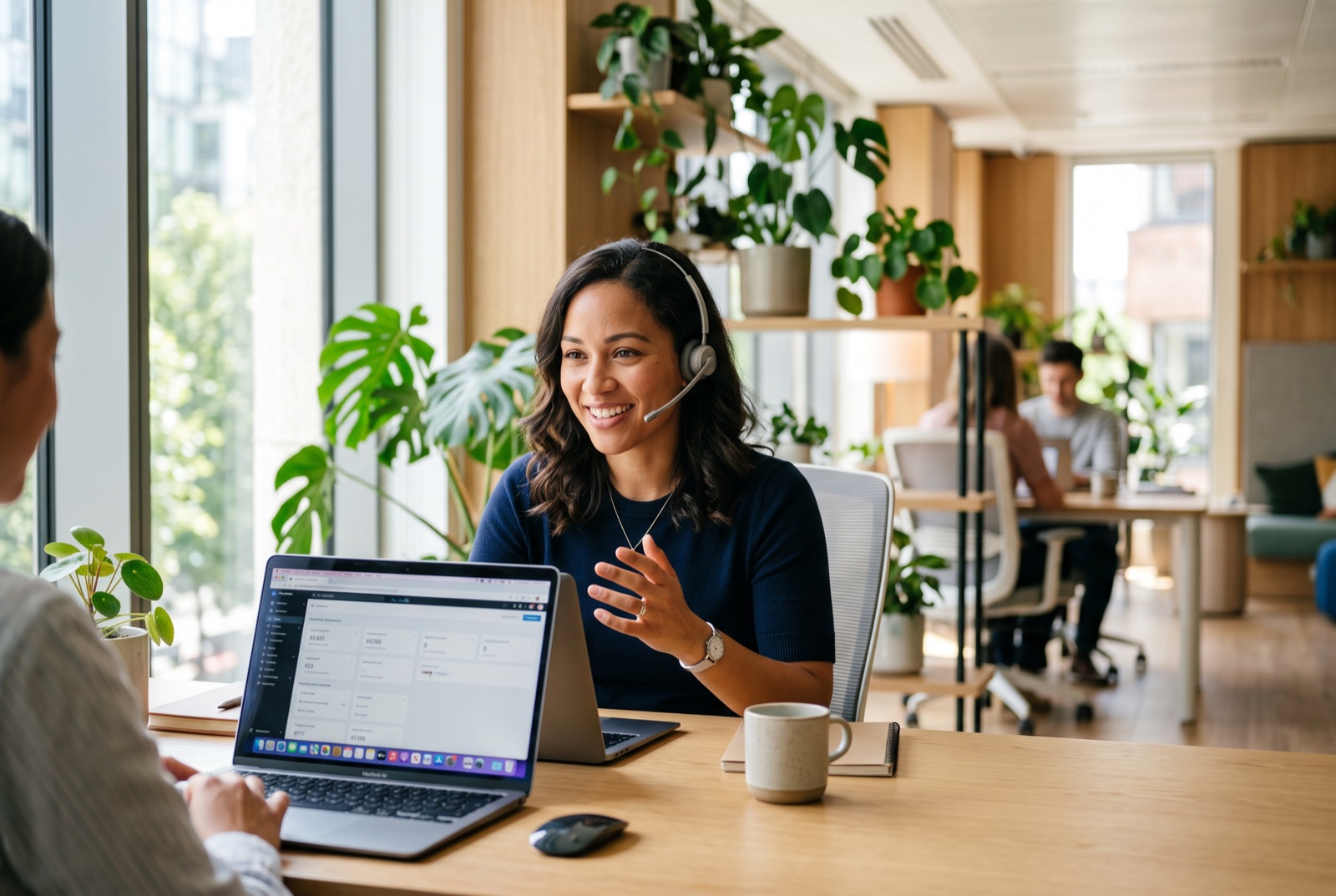 A support specialist with a headset helping a customer from a bright office